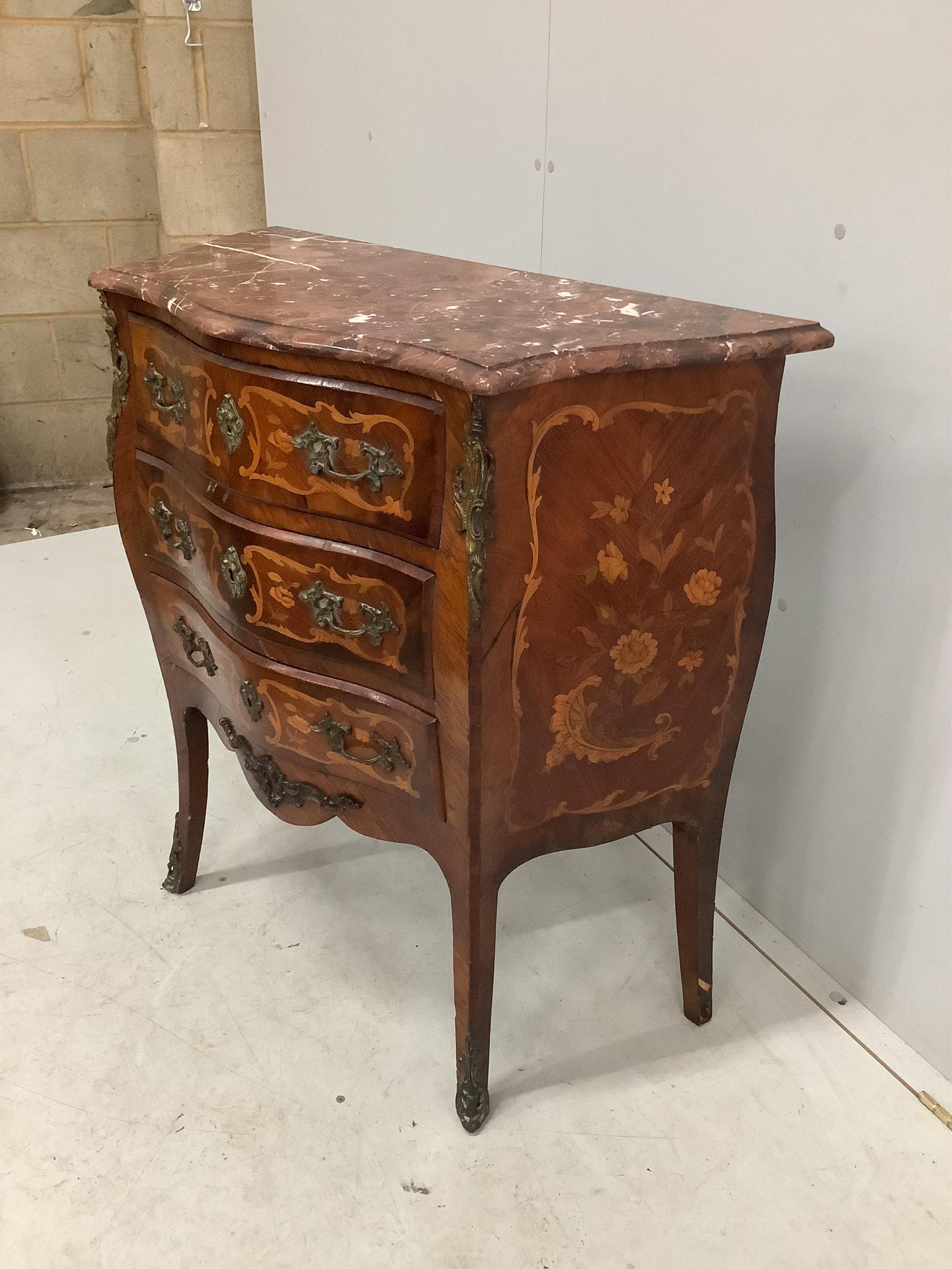 A small French gilt metal mounted marquetry inlaid marble topped bombe commode, width 80cm, depth 38cm, height 86cm. Condition - marble topped corner damaged but piece present